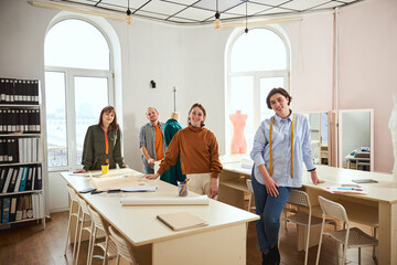 Team of tailor workshop posing for a photo