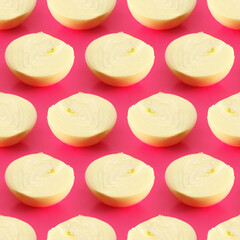 seamless pattern with a slice of onion on a pink background, bright trendy vegetable background for printing on textiles, fabric or paper, for advertising or banner