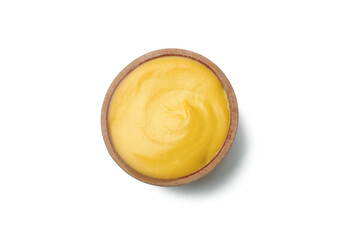 Wooden bowl with mustard isolated on white background