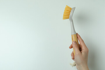 Female hand hold eco friendly brush on white background