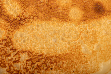 Traditional Russian pancakes, surface texture. Shrovetide week of spring meeting. Seeing off winter. Close-up.