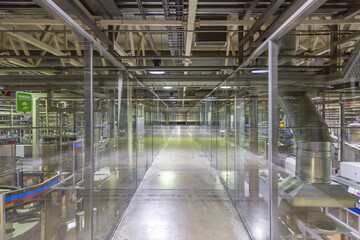 Inside the building of the Moscow Brewing Company plant. Long empty corridor in a modern industrial production area. Mytishchi, Russia