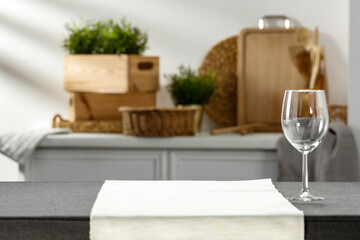 Kitchen table with tablecloth on a sunny summer day 