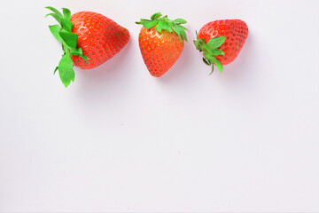 Zenith view. Strawberries on white background, copy space.
