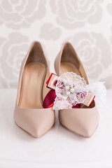 Wedding accessories: Bride's shoes and garter