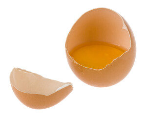 Broken chicken egg isolated on white background close-up.