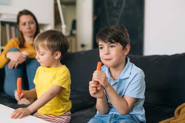 kids eating carrot at home