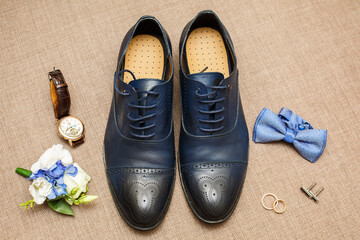 Groom's morning. Wedding accessories in blue colors. Shoes, bouquet and boutonniere