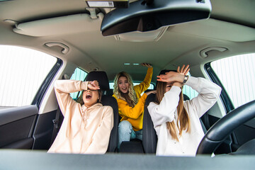 Three friends go on a trip. Young three women drive in a car shocked before car accident