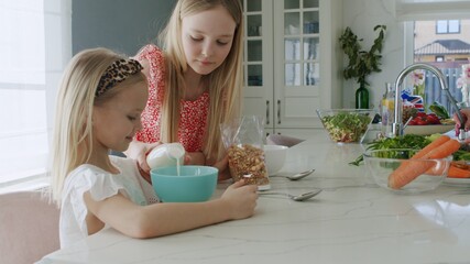 Two children eat healthy breakfast