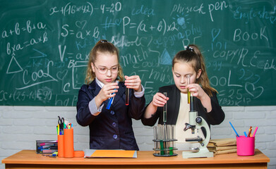 Doing research. Biology science. Happy little girls. Little girls scientist work with microscope. Chemistry research. science experiments in laboratory. Little girls in school lab. Science is future