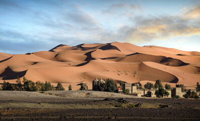 Amazing sunrise over the dunes in the Sahara desert near Merzouga, Morocco , Africa. Beautiful sand...