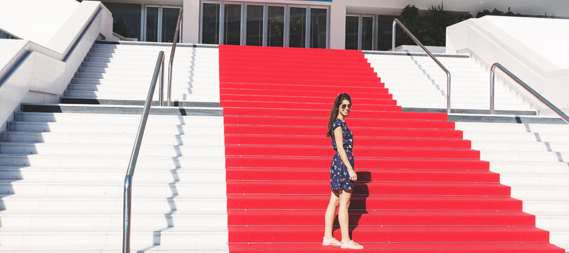 Tourist Woman on the Stairs with Red Carpet in Cannes ,France