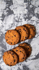 Cookies with chocolate icing, on gray packaging paper, copy space, template