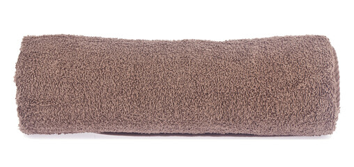 Fototapeta na wymiar Brown terry towel isolated on white background close-up.