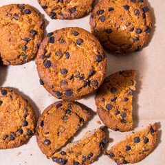 Cookies with chocolate icing, on gray packaging paper, copy space, template