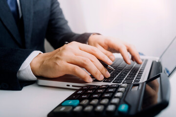 bookkeeper using calculator counting finances taxes fees accounting calculate bills money planning...
