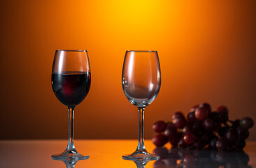 Two glasses of red wine on a beautiful sunset background. holiday mood