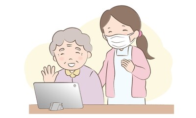 オンライン面会をするおばあさんと見守る職員