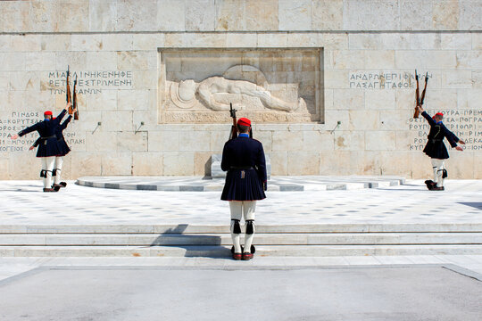 Men from the presidential guard (Evzones) during the changing of the guards, in front of The Tomb of the Unknown soldier in Athens, Greece. Sunny day