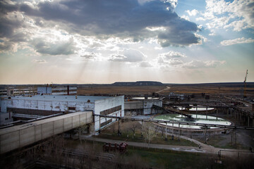 Outdated Soviet mining and processing factory. Water purification plant. Panorama view. Title on building: Labor Glory.