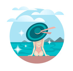 The girl who sits in a hat and a swimsuit by the sea