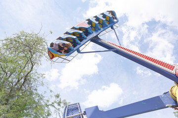 Brave citizens ride the attraction "Kamikaze" in amusement park
