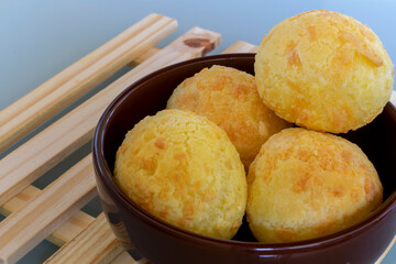 cheese bread detail in bowl on wooden pallet