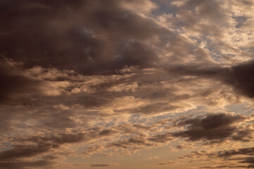 Naklejka na ściany i meble Sunset sky with orange clouds. Nature background.