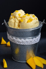 mango fruit ice cream cup decorated dark background