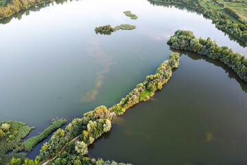 Aerial view of freshwater lake with island, summer landscape