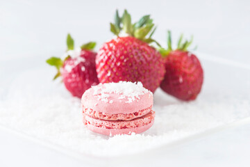 Pink french macaroon and strawberries close up