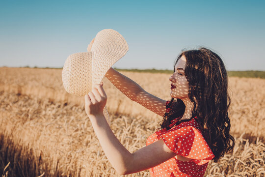 Sun Protection, sunscreen , UV protection, Time Outside and Stay Sun-safe. Young woman with straw hat protects from sun and enjoying nature