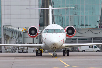 Airplane wing with engine, view under the plane during flight service.