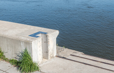 Modern concrete flood protection embankment wall with groove for fitting protective panels