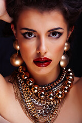 Naklejka premium beauty rich brunette woman with a lot of jewellery, hispanic curly lady posing very emotional