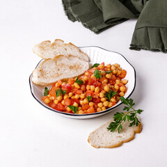 Chickpeas with tomatoes and parsley