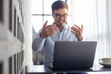 Fototapeta premium asian man work using computer hand typing laptop keyboard contact us.student study learning education online.adult professional people chatting search at office.concept for technology device business