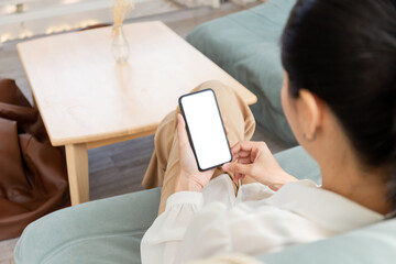 cell phone blank white screen mockup.woman hand holding texting using mobile on desk at office.background empty space for advertise.work people contact marketing business,technology
