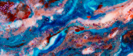 Horizontal banner background acrylic blue with red and pink stains sprinkled with sparkles....