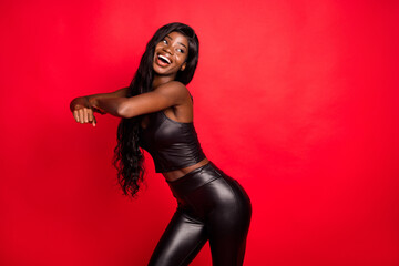 Portrait of attractive cheerful girl wearing leather moving dancing clubbing copy space isolated on...