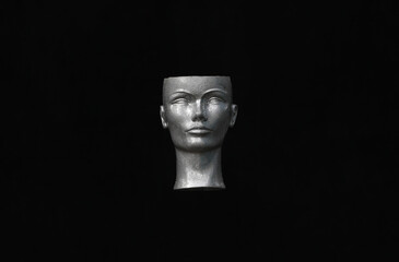 mannequin head on black background