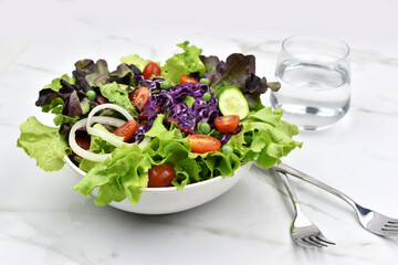 top view of salad form fresh green leaves mix and vegetables