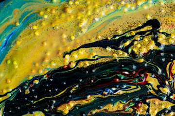 Liquid multicolored marble sprinkled with sparkles. Contemporary creativity. A colorful avant-garde painting with rich texture. A background made up of many shapes and materials.