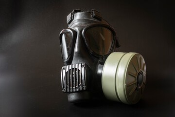 Military gas mask on black background.