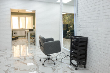 barber chair and mirrors in an elite beauty salon, cosmetologist's office interior