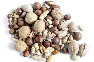 slide nuts scattered on a light background top view assorted nuts close up