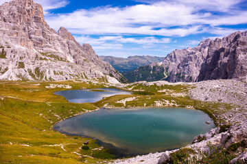 Fototapeta na wymiar Beautiful mountain lakes in Italian Dolomites, hiking and recreation destination