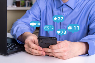 Social media interactions on smart mobile phone. Concept of notification icons of like, message, email and comment.