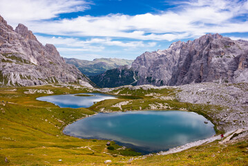 Naklejka na ściany i meble Beautiful mountain lakes in Italian Dolomites, hiking and recreation destination